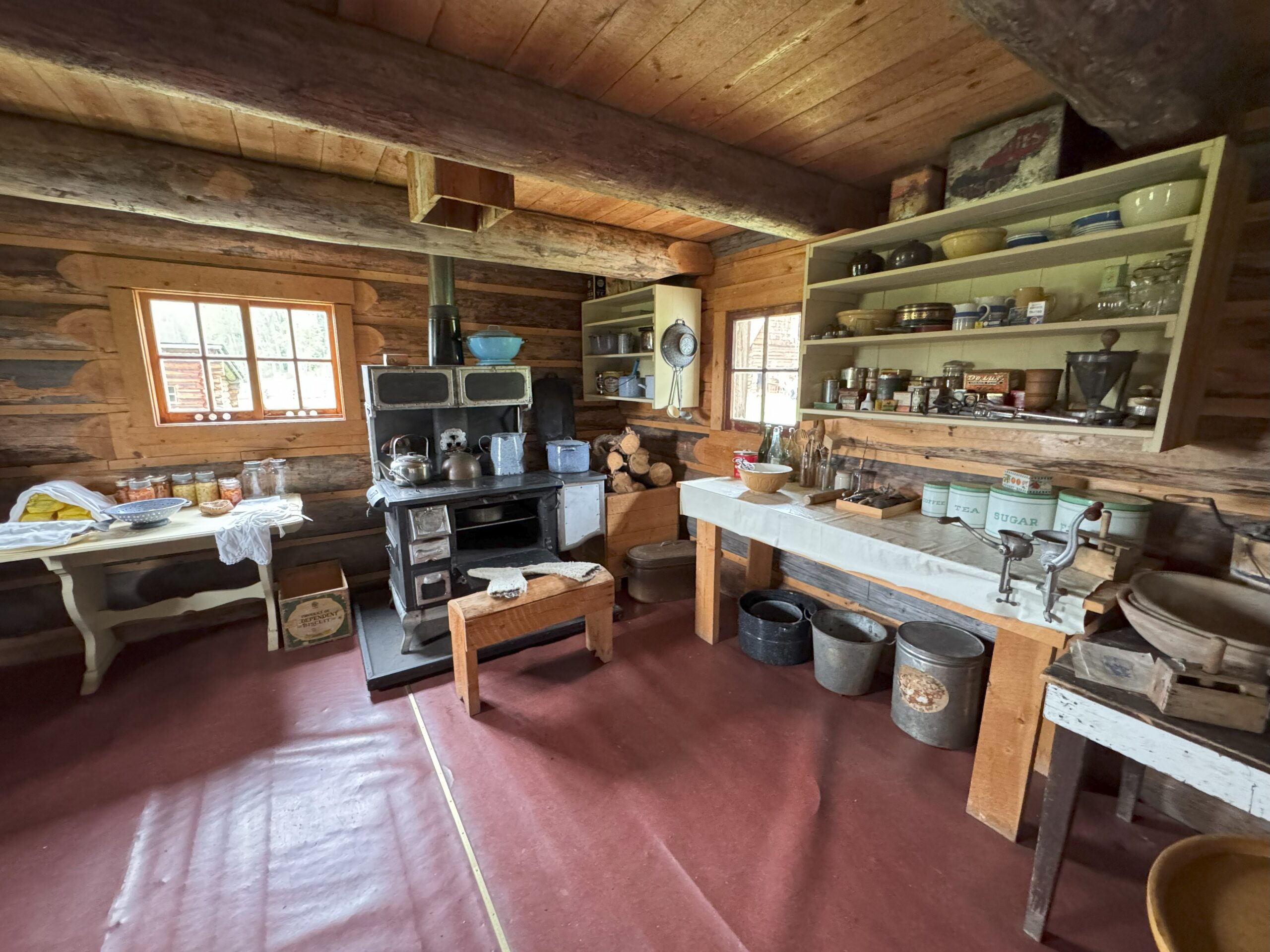 Interior view of the historic Huble House kitchen with vintage cookware and furnishings.