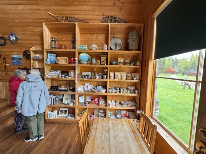 Interior of a rustic wooden market showcasing vintage decor alongside modern goods for sale