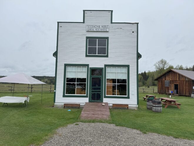 Exterior view of a historic rural market building with wooden architecture and rustic charm