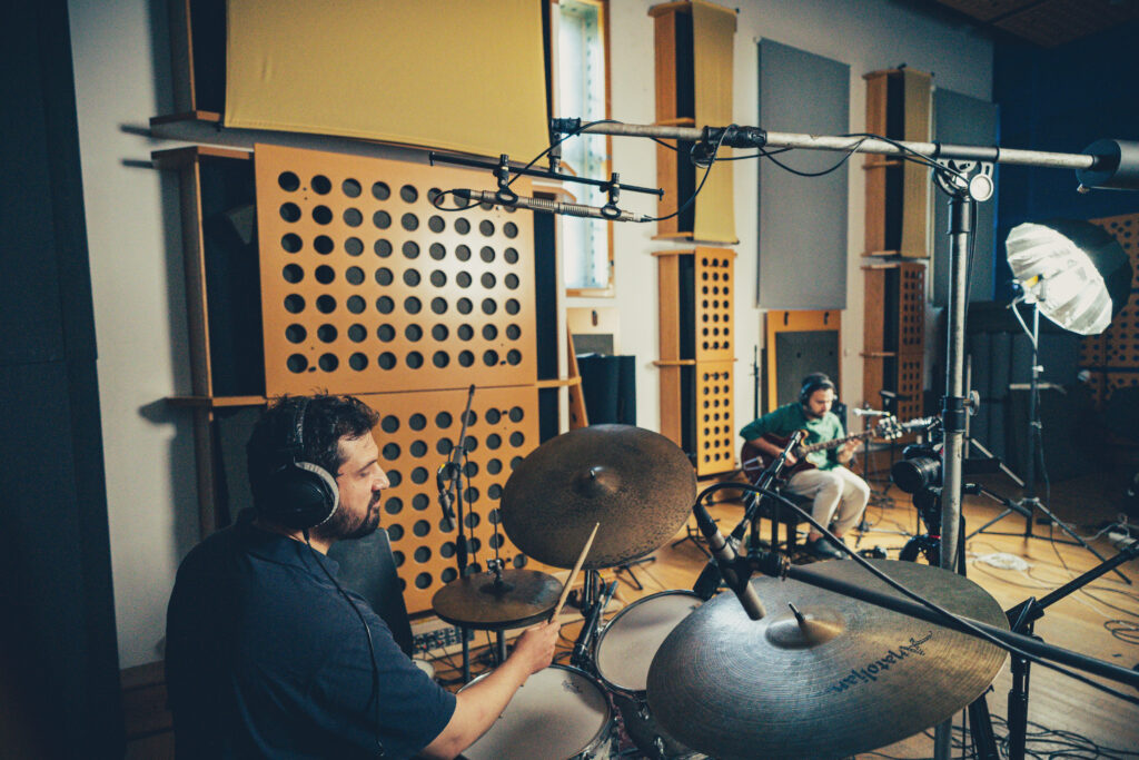 Zenith - Efe Oğur Efe Oğur plays drums in a recording studio, wearing headphones, during a session for the Zenith jazz album.