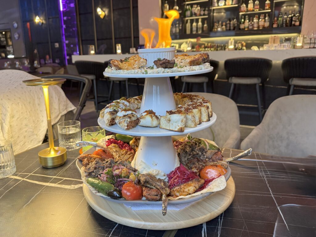 The VIP Fire Tower for 4 at Sibel Restaurant, a multi-tiered platter featuring a variety of grilled meats and traditional Turkish dishes.