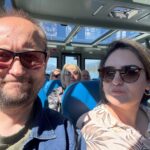 A couple takes a selfie inside the Maligne Lake tour boat.