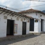White colonial buildings in Girón housing local restaurants.
