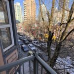 Private balcony view from Times Square Suites Hotel overlooking the streets of Vancouver.