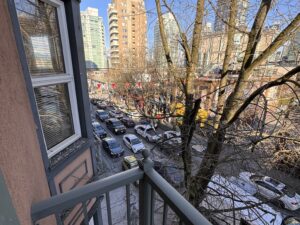 Private balcony view from Times Square Suites Hotel overlooking the streets of Vancouver.