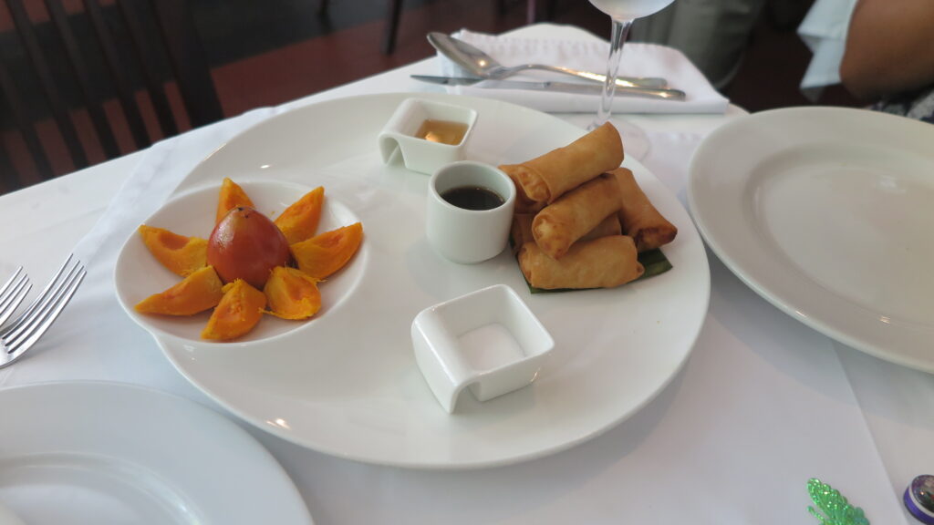 Chandaturo and Chandaturo Rolls Platillos Voladores Cali Colombia Chandaturo and Chandaturo Rolls served at Platillos Voladores in Cali, Colombia, featuring crispy Colombian rolls with fresh chontaduro fruit and traditional dipping sauces.