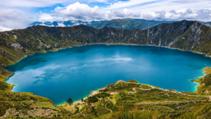 Panoramic view of Laguna de Quilotoa crater lake and the surrounding Andes Mountains from the viewpoint in Ecuador.