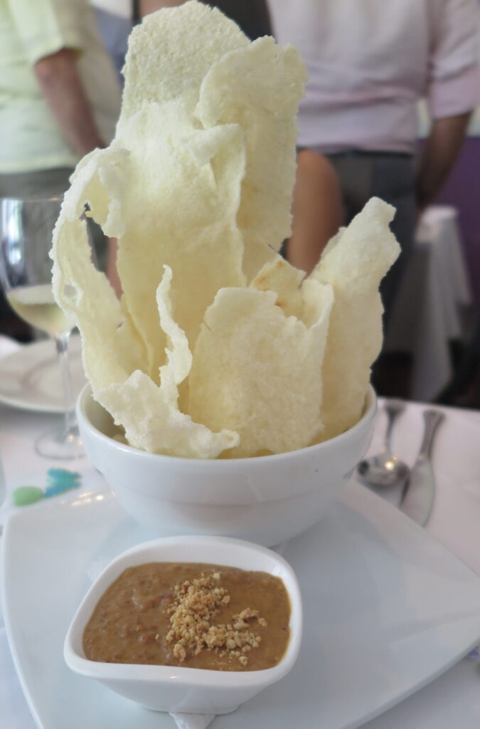 Carantanta Platillos Voladores Cali Colombia Carantanta appetizer at Platillos Voladores in Cali, Colombia, featuring crispy fried plantain with a flavorful Colombian seafood topping served in an elegant presentation.