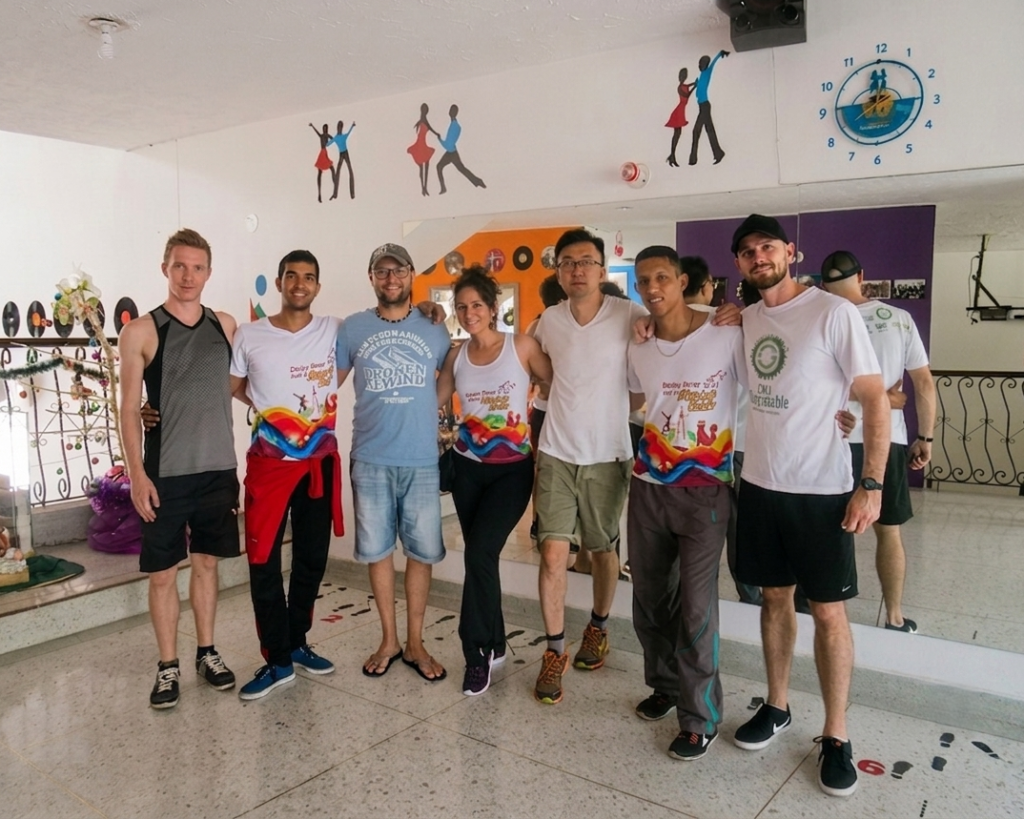 Salsa School in Cali Arrebato Caleño Salsa School Students and instructors posing together after a dance class at Arrebato Caleño Salsa School, experiencing salsa school in Cali, Colombia.