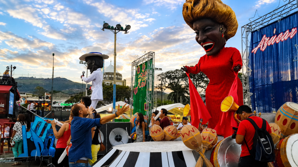 Salsa in Cali Colombia 1 Giant parade puppets and dancers during the Salsa in Cali celebrations at Feria de Cali in Cali, Colombia