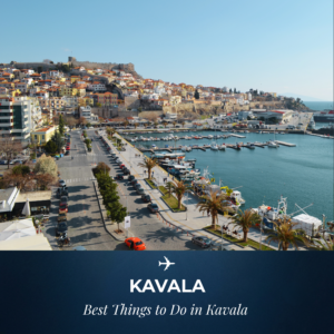 Panoramic high-angle view of Kavala harbor in Greece with boats docked at the port, palm trees along the waterfront promenade, colorful hillside houses, and the historic Kavala Castle on top, featuring text overlay "Kavala - Best Things to Do in Kavala"