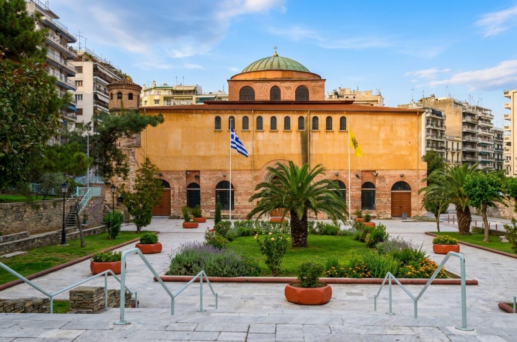 Restored facade of the historic Hagia Sophia Church in Thessaloniki, Greece, with its courtyard and bell tower