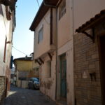 Things to do in Kavala - A continuing narrow stone alley in the Panagia Old Town of Kavala, Greece, featuring traditional Ottoman-style houses with overhanging upper floors.
