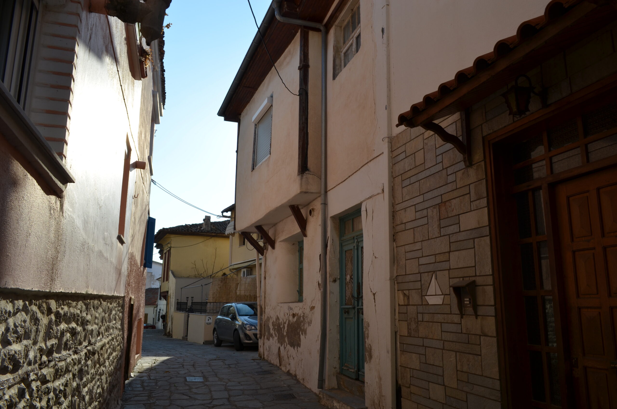 Things to do in Kavala - A continuing narrow stone alley in the Panagia Old Town of Kavala, Greece, featuring traditional Ottoman-style houses with overhanging upper floors.