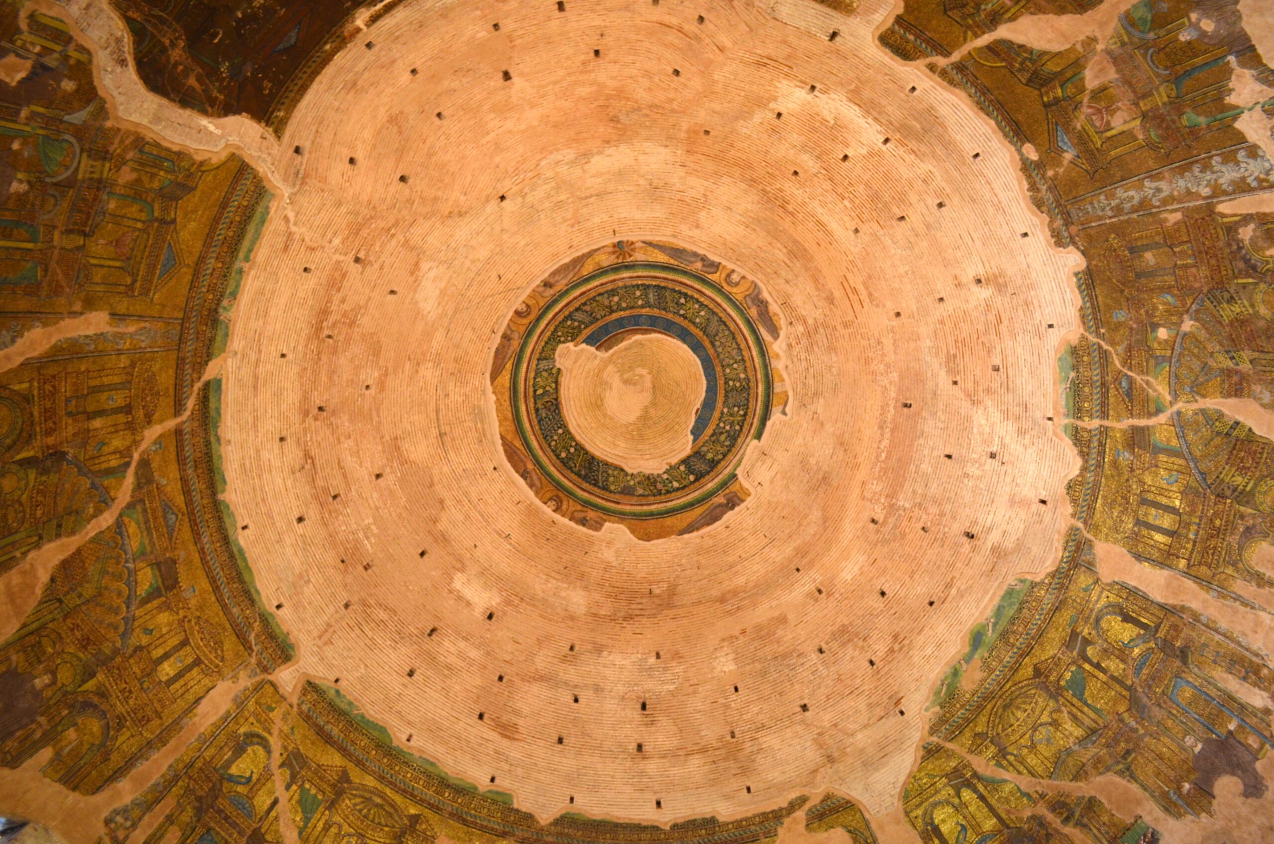Interior dome of the Rotunda in Thessaloniki with Byzantine mosaic fragments and exposed brickwork
