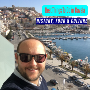 Best Things to Do in Kavala - A smiling man wearing sunglasses taking a selfie on a balcony overlooking the harbor and historic Kavala Fortress in Kavala, Greece.
