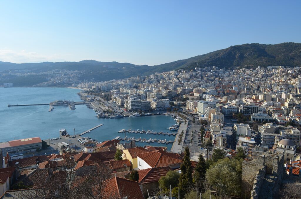 Kavala Greece Best Things to Do in Kavala - Panoramic high-angle view of Kavala city, harbor, Aegean Sea, and surrounding mountains taken from the Kavala Castle, Greece.